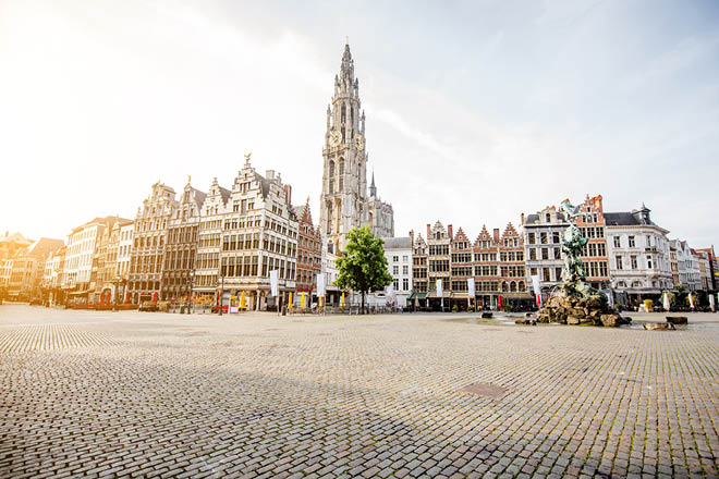 Morning view on the Grote Markt with beautiful buildings and church tower in Antwerpen city, Belgium