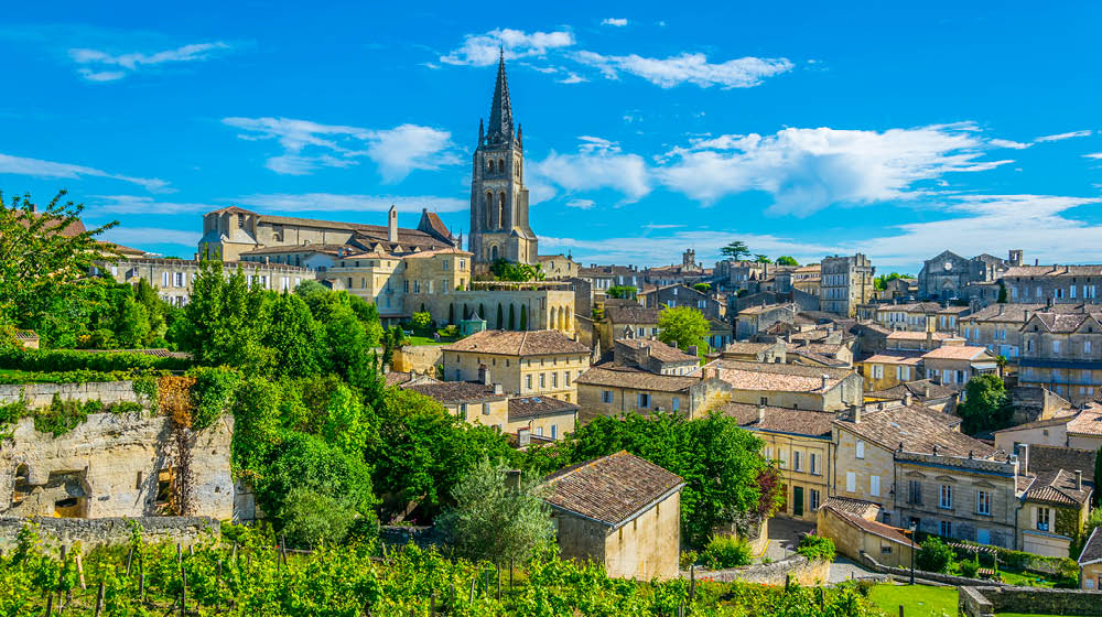 Aerial view of French village Saint Emilion dominated by spire of the monolithic church