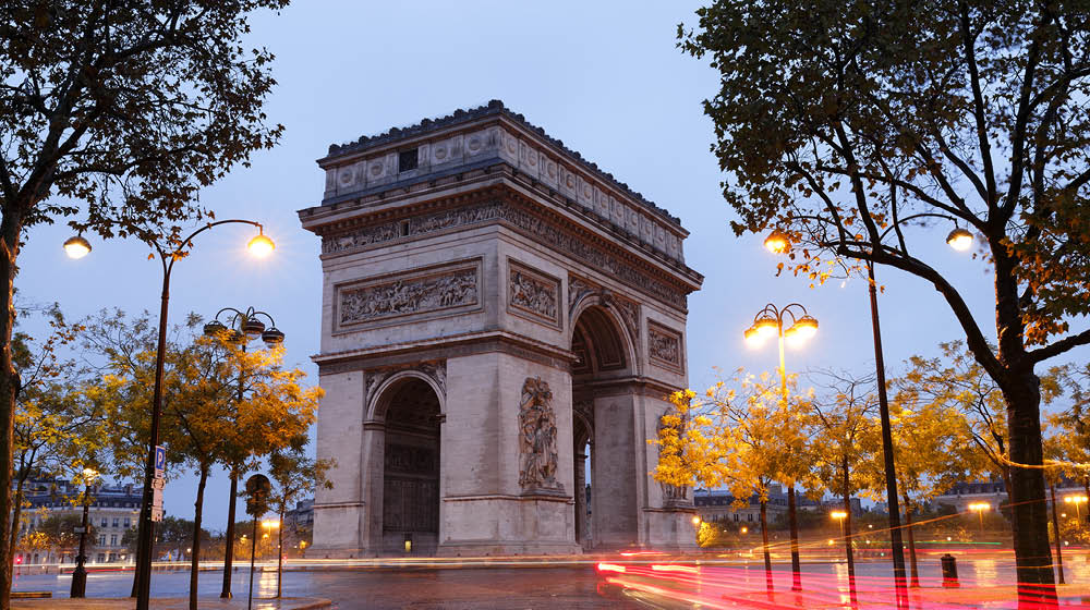 The Triumphal Arch in rainy Morning. It is one of the most famous monuments in Paris. It honors those who fought and died for France.