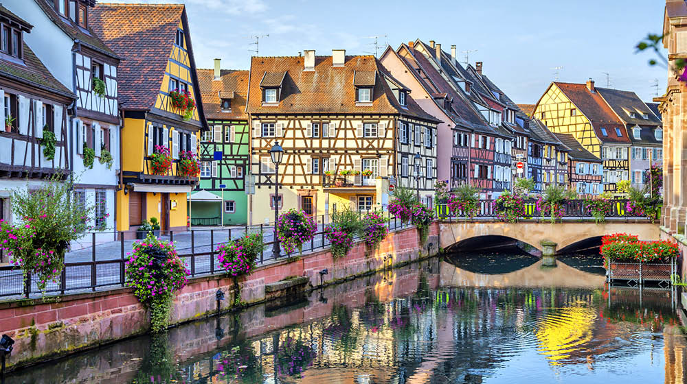 Colorful traditional french houses on the side of river Lauch in Petite Venise, Colmar, France