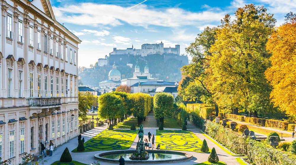 Beautiful view of famous Mirabell Gardens with the old historic Fortress Hohensalzburg in the background in Salzburg, Austria