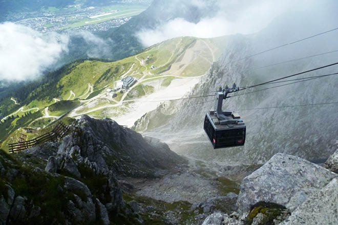 Overhead cable car seen from above on the Austrian Nordkette Alps, Innsbruck below.