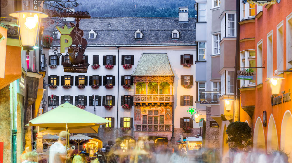 INNSBRUCK, AUSTRIA - AUG 14: The Golden Roof, ornamented with 2,738 fire-gilded copper tiles for Emperor Maximilian I to mark his wedding to Bianca Sforza on Aug 14, 2013 in Innsbruck, Austria.