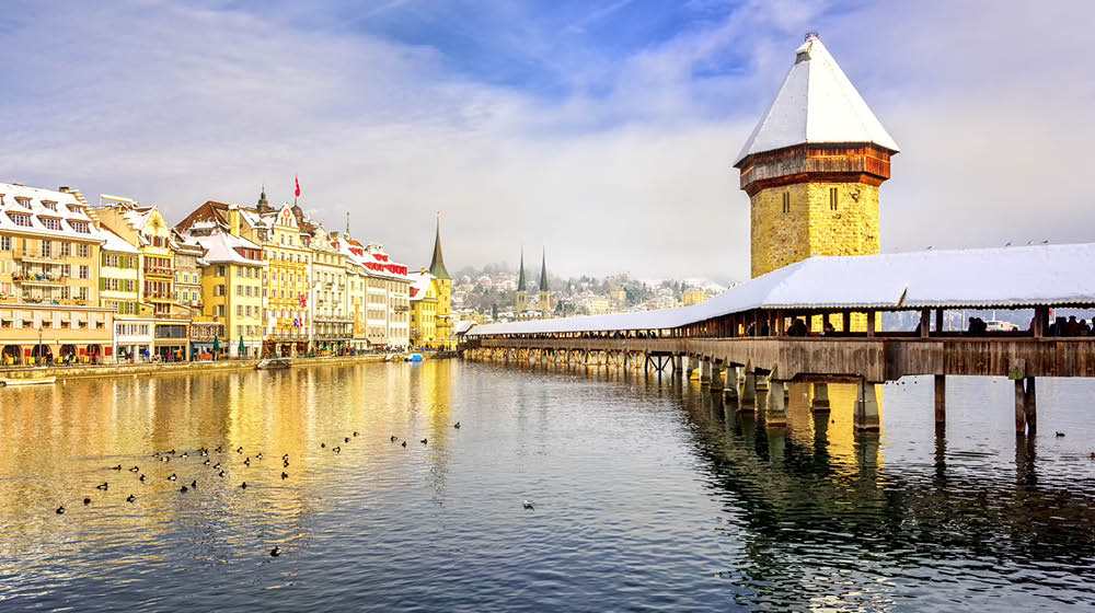 Lucerne, Switzerland, Chapel bridge and Water Tower on a white snowy winter day