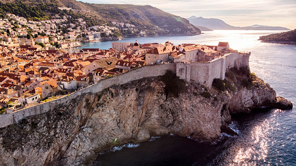 Dubrovnik old town city walls aerial view in a sunny day
