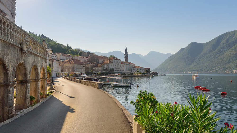 Scenic panorama of the historic town of Perast at famous Kotor Bay. Beautiful sunny day with blue sky, Montenegro, southern Europe