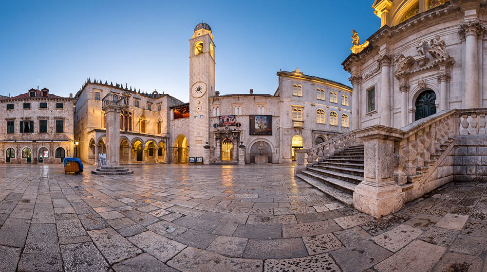 DUBROVNIK, CROATIA - JULY 1, 2014: Panorama of Luza Square and Sponza Palace in Dubrovnik. In 1979, the city of Dubrovnik joined the UNESCO list of World Heritage Sites.