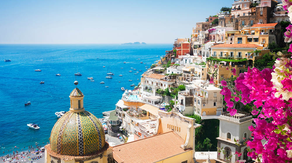 view of Positano with flowers - famous old italian resort, Italy