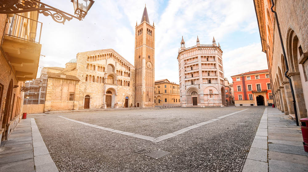 Parma cathedral with Baptistery leaning tower on the central square in Parma town in Italy