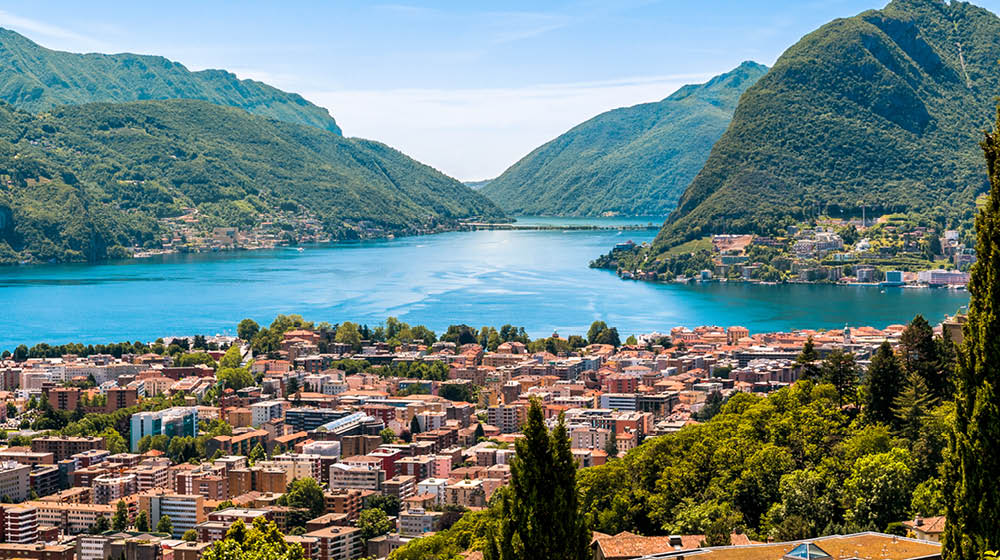 Landscape of Lugano lake, mountains and the city located below, Ticino, Switzerland