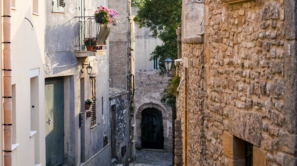 Ancient medieval cobblestone street in Erice, Sicily, Italy