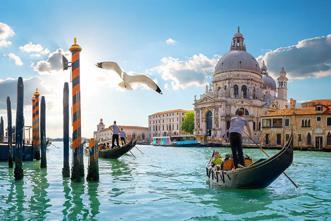 Ride on gondolas along the Gand Canal in Venice, Italy