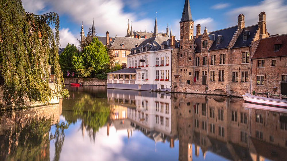 Long exposure Idyllic blurred Rozenhoedkaai at sunrise – Bruges medieval old town - Belgium