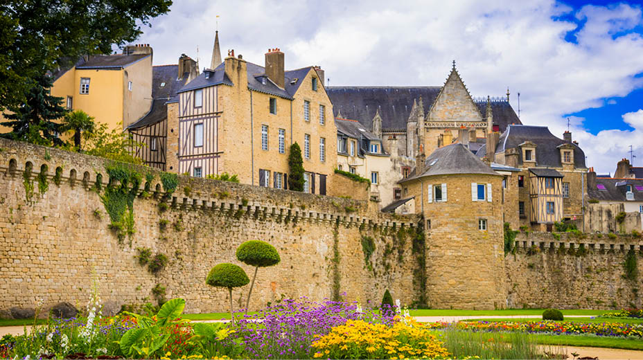 Ancient buildings of Vannes with half-timbered houses and stone city walls.
