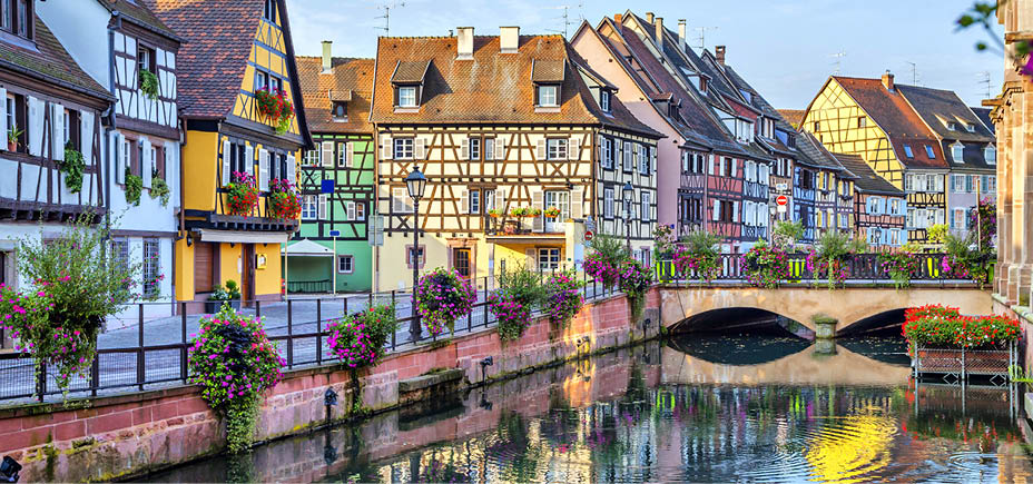Colorful traditional french houses on the side of river Lauch in Petite Venise, Colmar, France