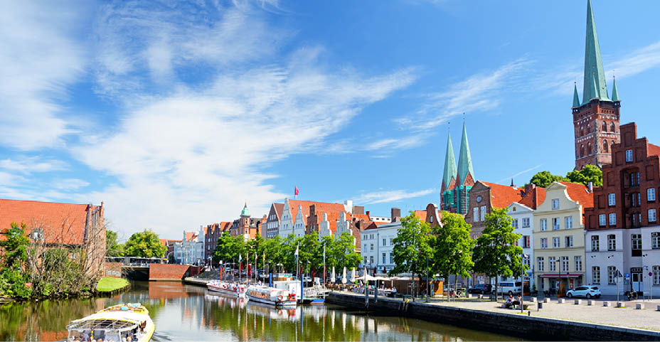 L beck old town and River Trave at sunny day, Germany. Composite photo