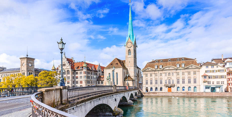 Zurich, Switzerland. View of the historic city center with famous Fraumunster Church, on the Limmat river.