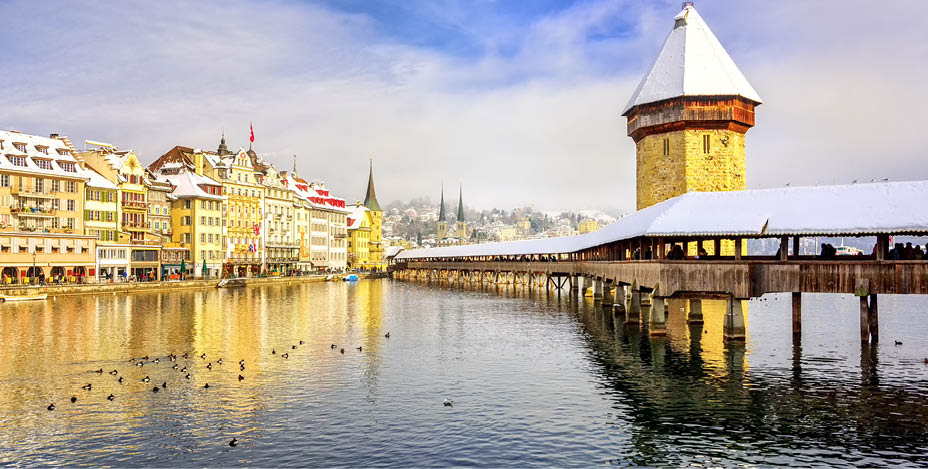 Lucerne, Switzerland, Chapel bridge and Water Tower on a white snowy winter day