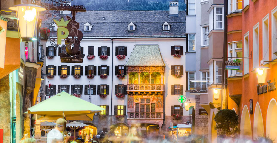 INNSBRUCK, AUSTRIA - AUG 14: The Golden Roof, ornamented with 2,738 fire-gilded copper tiles for Emperor Maximilian I to mark his wedding to Bianca Sforza on Aug 14, 2013 in Innsbruck, Austria.
