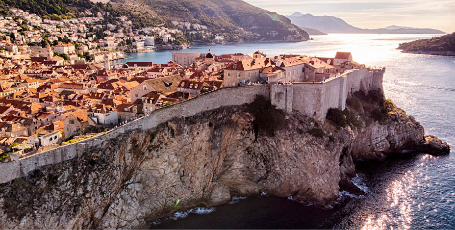 Dubrovnik old town city walls aerial view in a sunny day