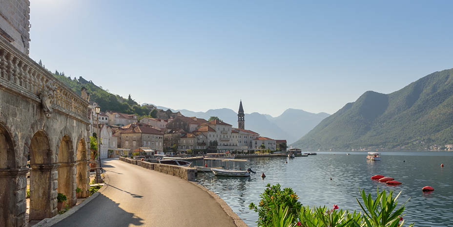 Scenic panorama of the historic town of Perast at famous Kotor Bay. Beautiful sunny day with blue sky, Montenegro, southern Europe