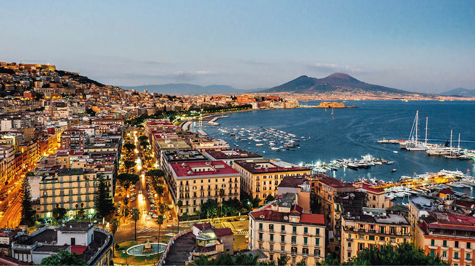 Naples at sunset - Gulf of Naples, Italy. View of the city from elevated point of view.