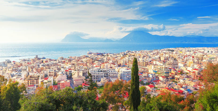 Patras city, Greece, view from above scenery. Patras is Greece's third-largest city and the regional capital of Western Greece, in the northern Peloponnese, 215 km (134 mi) west of Athens.