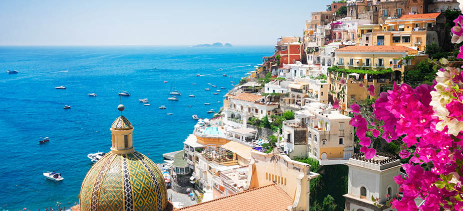 view of Positano with flowers - famous old italian resort, Italy