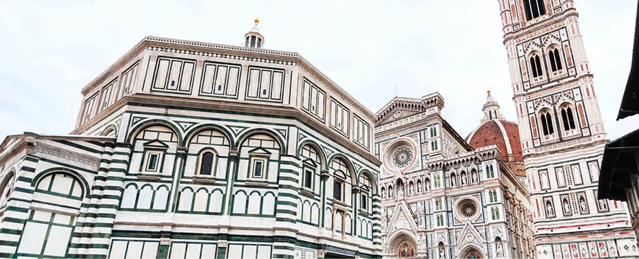 travel to Italy - view of Florence Baptistery (Battistero di San Giovanni, Baptistery of Saint John) and Duomo Cathedral Santa Maria del Fiore with Giotto's Campanile on Piazza San Giovanni in morning
