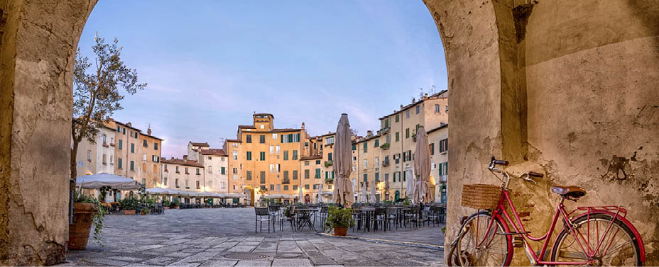 Lucca, Italy. View of Piazza dell'Anfiteatro square through the arch