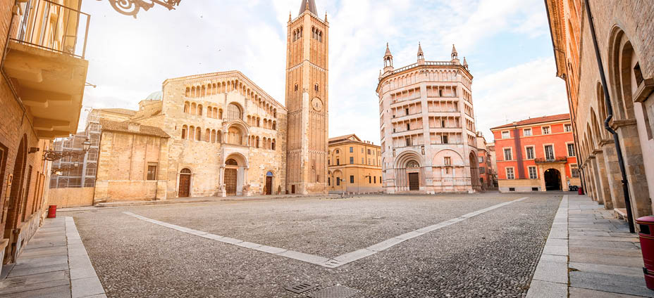 Parma cathedral with Baptistery leaning tower on the central square in Parma town in Italy