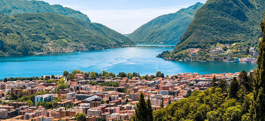Landscape of Lugano lake, mountains and the city located below, Ticino, Switzerland