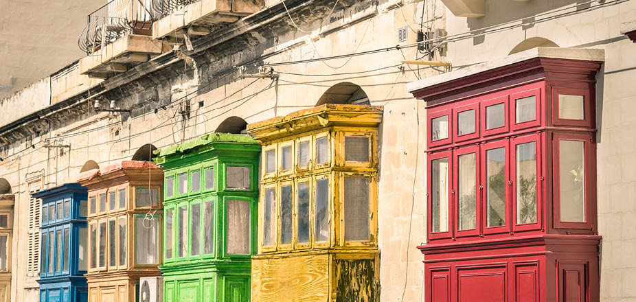 Vintage view of typical buildings balconies in La Valletta - Colorful travel in Malta on the road - Popped up filtered version